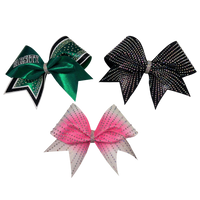 Set of three rhinestone bows, green on the left, black on the right and pink in the middle.